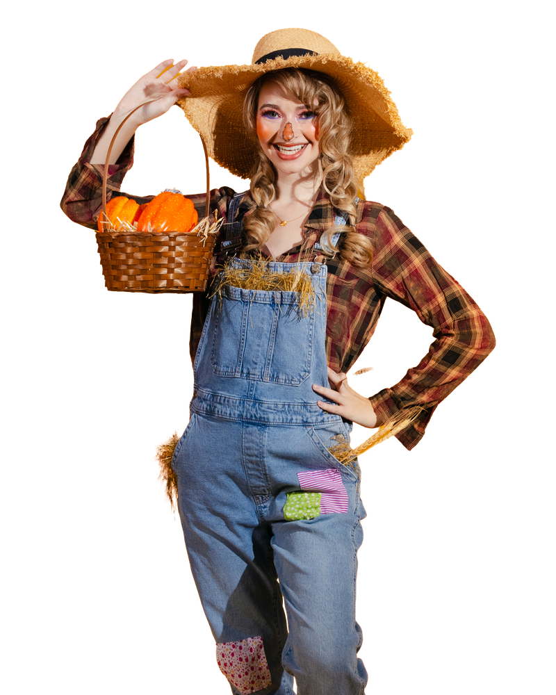 A scarecrow costume with patched denim overalls, plaid shirt, straw hat and a pumpkin basket.
