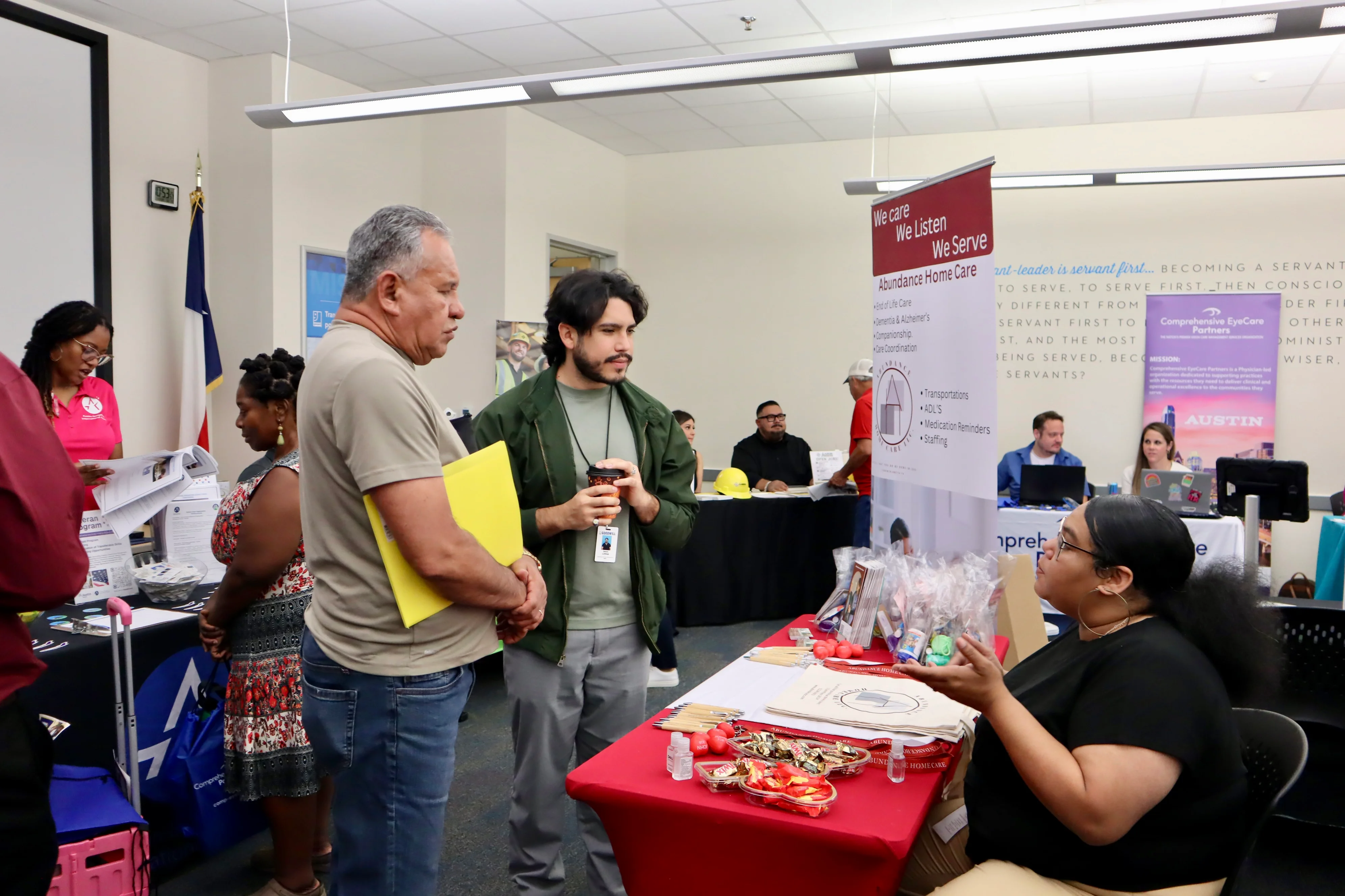 Job seekers meeting with recruiters at a Goodwill Central Texas job fair